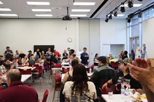 large group in classroom chatting