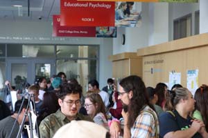 hallway full of students presenting posters