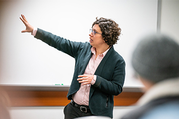 lauren barth-cohen gesturing with her hand while teaching her class